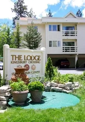 a house with a sign in front of a yard at Lodge at Kingsbury Crossing in Stateline