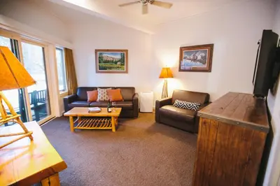 a living room with a couch and a table at Sunnyside Resort and Lodge in Tahoe City