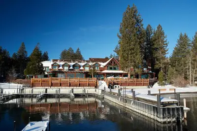 a house on the water with a dock at Sunnyside Resort and Lodge in Tahoe City