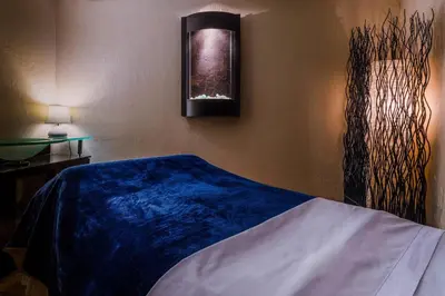 a bedroom with a blue blanket on the wall at Marriott Grand Residence Club, Lake Tahoe in South Lake Tahoe