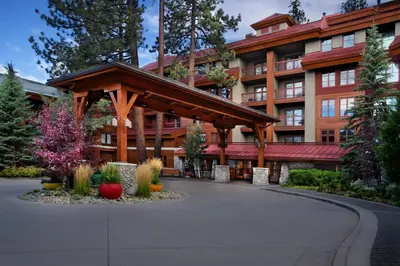 a large building with a wooden pavilion in front of it at Marriott Grand Residence Club, Lake Tahoe in South Lake Tahoe