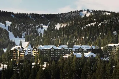 a resort with snow covered roofs on a mountain at The Ritz-Carlton, Lake Tahoe in Truckee