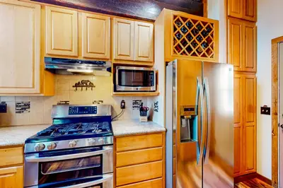 a kitchen with a stove and a refrigerator at Commonwealth Retreat in Kings Beach
