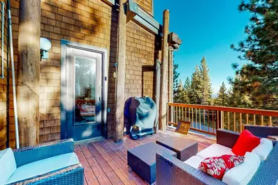 a porch with a couch and a stroller at Commonwealth Retreat in Kings Beach