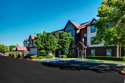 a large house with a street in front of it at TownePlace Suites Fresno in Fresno
