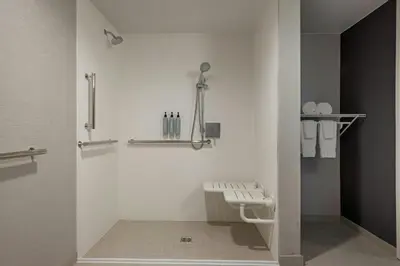 a bathroom with a toilet in a room at Courtyard by Marriott Sacramento Midtown in Sacramento
