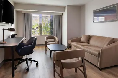 a living room with a couch and a table at Fairfield Inn Sacramento Cal Expo in Sacramento