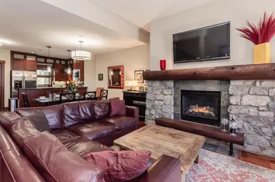 a living room with a couch and a fireplace at Juniper Crest 3 in Old Mammoth