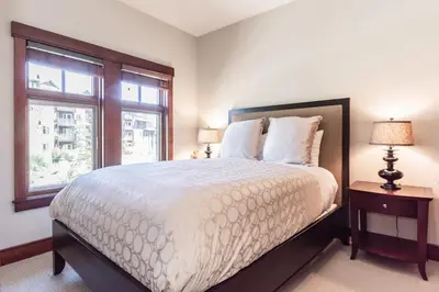 a bedroom with a large bed and a window at Juniper Crest 3 in Old Mammoth