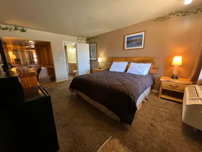 a bedroom with a large bed with two pillows at The Trailhead in South Lake Tahoe