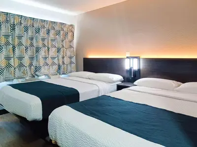a hotel room with two beds and a window at Motel 6-Fresno, CA - Blackstone North in Fresno