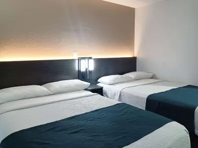 a hotel room with two beds in a room at Motel 6-Fresno, CA - Blackstone North in Fresno