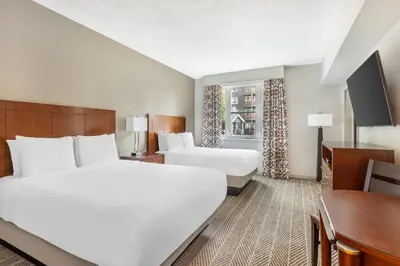 a hotel room with two beds and a desk at Hilton Vacation Club Lake Tahoe Resort South in South Lake Tahoe