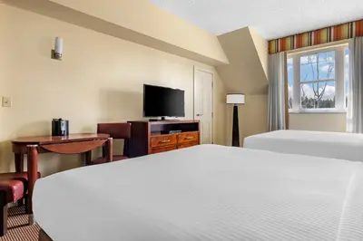 a hotel room with two beds and a flat screen tv at Hilton Vacation Club Lake Tahoe Resort South in South Lake Tahoe