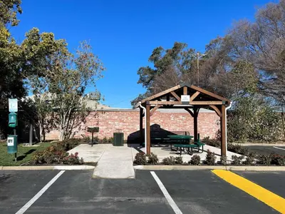 a pavilion with a bench in a parking lot at Motel 6-Lodi, CA in Lodi