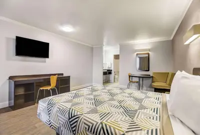 a hotel room with a bed and a desk at Motel 6-Lodi, CA in Lodi