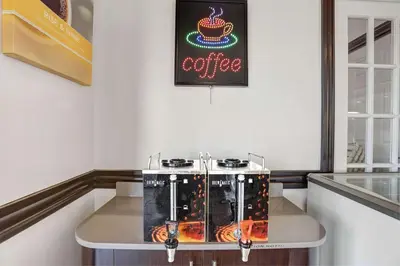 a table with a coffee machine in a room at Motel 6-Lodi, CA in Lodi