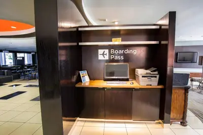 a lobby with a desk with a computer on it at Courtyard by Marriott Merced in Merced