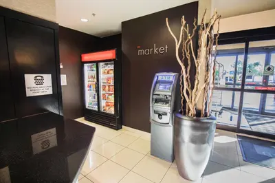 a grocery store with a cash machine in a store at Courtyard by Marriott Merced in Merced