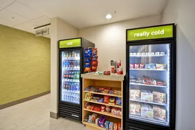 a store with two refrigerators in a store at Home2 Suites By Hilton Hanford Lemoore in Hanford