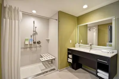 a bathroom with a sink and a shower at Home2 Suites By Hilton Hanford Lemoore in Hanford