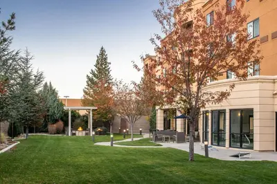 a green lawn in front of a building at Courtyard Carson City in Carson City