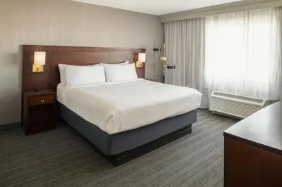 a hotel room with a large bed and a window at Courtyard Carson City in Carson City