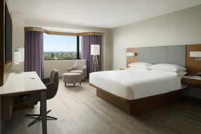 a hotel room with a bed and a desk and chair at Sacramento Marriott Rancho Cordova in Rancho Cordova
