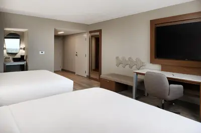 a hotel room with two beds and a flat screen tv at Sacramento Marriott Rancho Cordova in Rancho Cordova