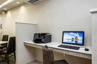 a desk with a computer and a printer on it at Residence Inn by Marriott Stockton in Stockton