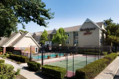 a tennis court in front of a hotel at Residence Inn by Marriott Stockton in Stockton