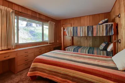 a bedroom with a bed and a window at 99 Yosemite Mountain Lodge in Wawona