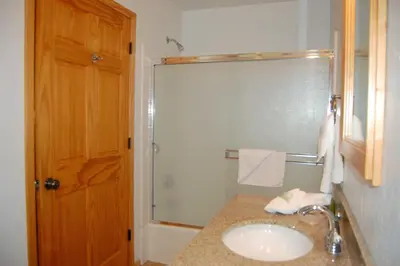 a bathroom with a sink and a shower at 9N Fox Hollow in Wawona