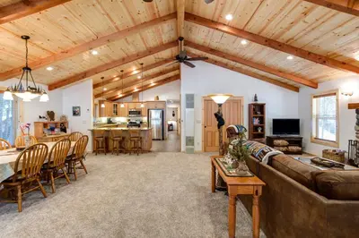 a living room with a couch and a table at 36 Larkspur Lair in Wawona