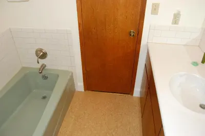 a bathroom with a tub and a sink at 43A Mountain Retreat in Wawona