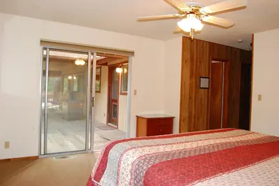 a bedroom with a bed and a ceiling fan at 43A Mountain Retreat in Wawona