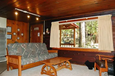 a living room with a couch and a window at 18 Le Fawn in North Wawona