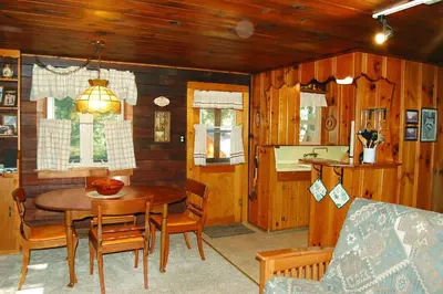 a kitchen and dining room with a table and chairs at 18 Le Fawn in North Wawona