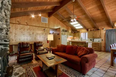 a living room with a couch and a table at 69 Bordentown West in Wawona