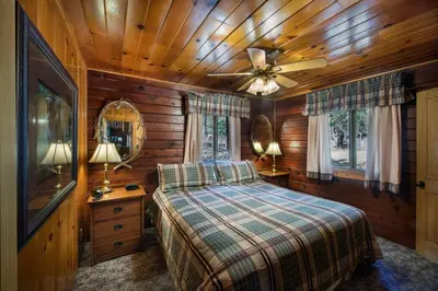 a bedroom with a bed and a ceiling fan at 72 Sequoia in North Wawona