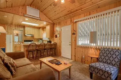 a living room with a couch and a table at 43R Edna's Hearts Desire in North Wawona