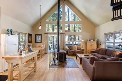 a living room with a couch and a table at 7S Wawona Chalet in Wawona