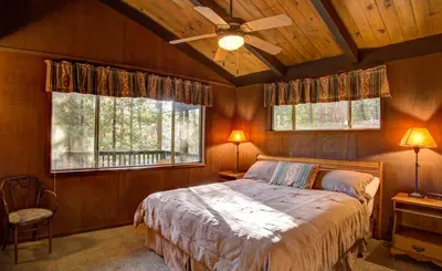 a bedroom with a bed and a ceiling fan at 18B Hiltbrand Hangout in Wawona