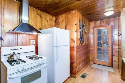 a kitchen with a white stove and a refrigerator at 50R Soots-Me in Wawona