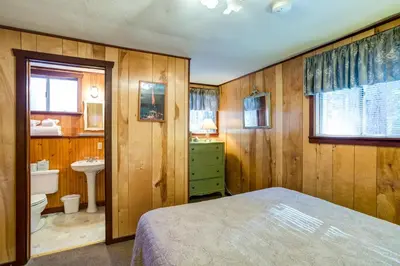 a bedroom with a bed and a sink and a toilet at 50R Soots-Me in Wawona