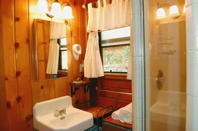 a bathroom with a sink and a shower at 35 Cubbys Den in Wawona