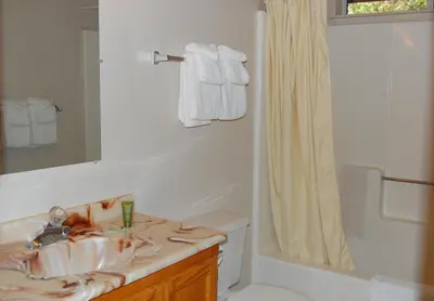 a bathroom with a sink and a toilet and a shower at 47R Altitude Adjustment in North Wawona