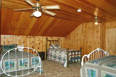 a bedroom with two beds and a ceiling fan at 44R Grant's Camp in Wawona