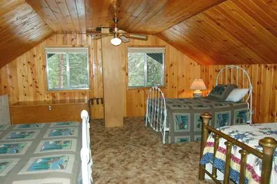 a bedroom with two beds in a cabin at 44R Grant's Camp in Wawona