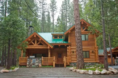 a log cabin in the woods at 67 El Capitan in North Wawona